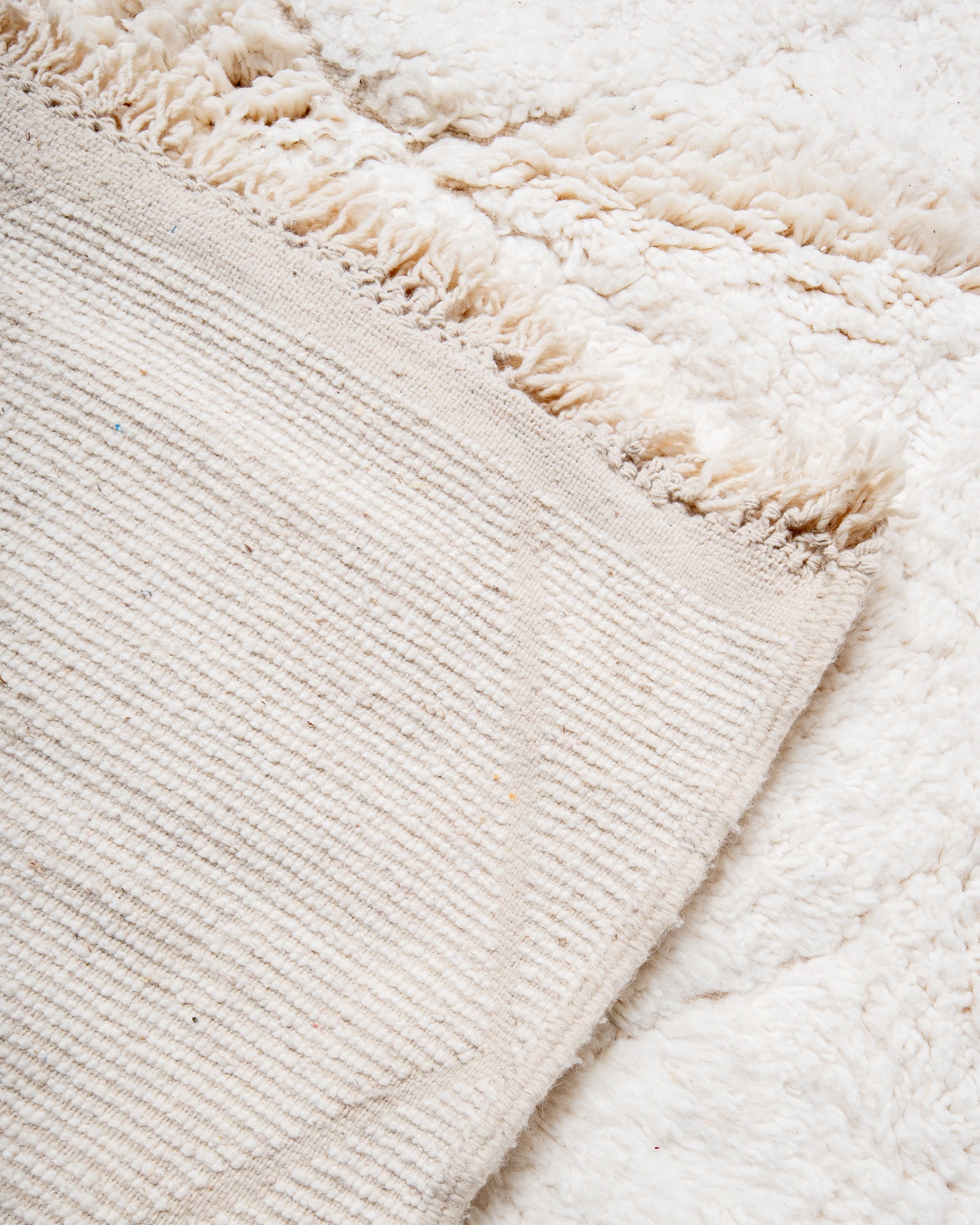 Modern, designer, handcrafted Berber rug from Morocco. Beniourain carpet with beautiful colours and patterns and fluffy wool texture.